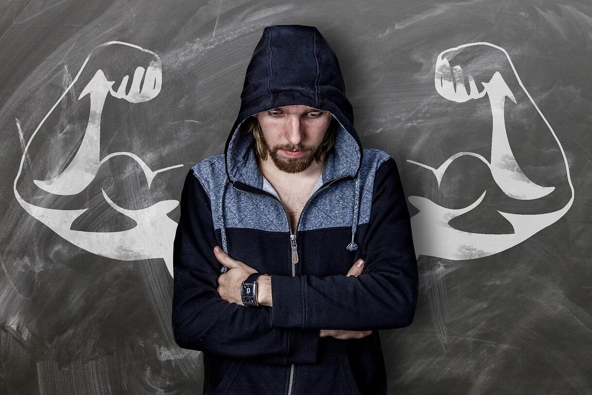 A man standing in front of a poster